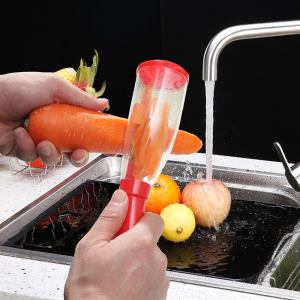Kitchen peeler with waste container