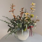 Faded greens artificial winter bouquet