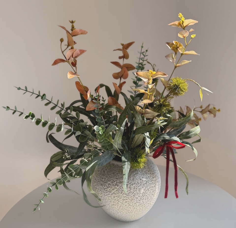 Faded greens artificial winter bouquet